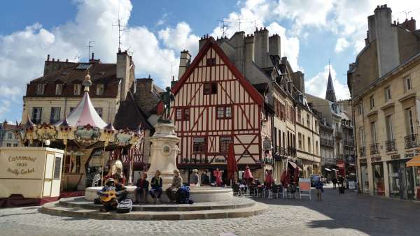 square in dijon with traditional wooden buildings in france